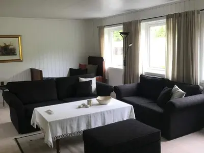 a living room with a couch and a table at 6 person holiday home in Halsanaustan-By Traum in Korsnes