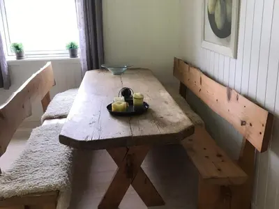 a wooden table with a bowl of fruit on it at 6 person holiday home in Halsanaustan-By Traum in Korsnes