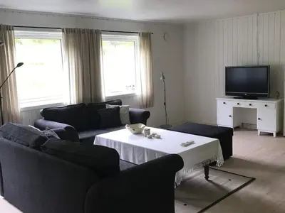 a living room with two couches and a tv at 6 person holiday home in Halsanaustan-By Traum in Korsnes