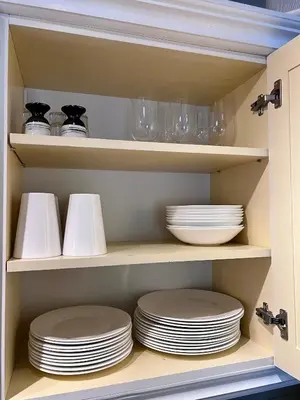 a cupboard filled with plates and bowls and dishes at Mountain retreat in Uvdal WIFI SAUNA in Uvdal
