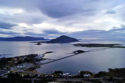 an aerial view of a large body of water with a bridge at Ytterland Apartments in Ålesund