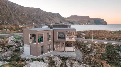 a house on a hill with a basketball hoop at Runde Panorama - Ørneredet in Runde