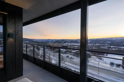 a balcony with a view of a city at Riddertunets luksuriøse in Beitostøl