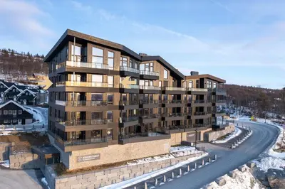 an aerial view of a building with a road at Riddertunets luksuriøse in Beitostøl