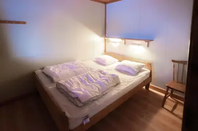 a bed in a room with two pillows on it at Fagertoppen 12B in Trysil