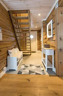 a room with a bed and a desk in a cabin at Lake View Apartment 4 bedrooms and 2 bathrooms in Sykkylven