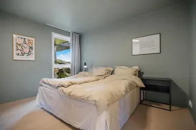 a bedroom with a bed in a room with a window at 