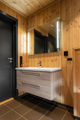 a bathroom with a sink and a mirror at Gaustablikk Hytte - MountainView in Gaustablikk