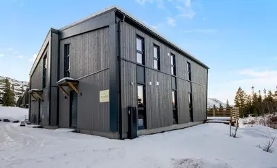 a metal building in the snow in the snow at Gaustablikk Hytte - MountainView in Gaustablikk
