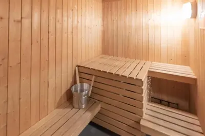 a wooden sauna with a trash can in it at Bakkebyvegen 1D in Trysil