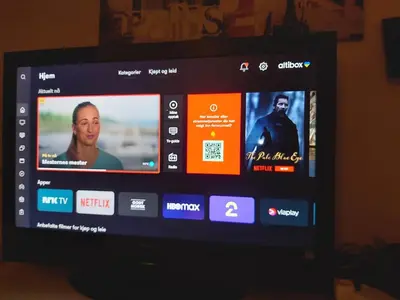 a television screen with several different videos on it at Ålesund Apartment with free parking in Ålesund