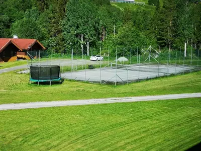 a tennis court in a field with a car on it at Actif 329 - apartment by Ål skisenter in Ål