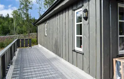 a gray building with a walkway next to it at 4 Bedroom Pet Friendly Home In Eggedal in Eggedal