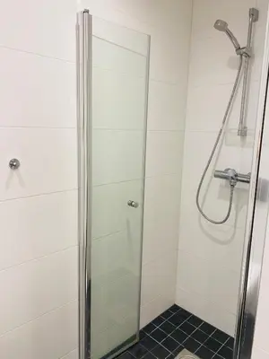 a shower with a glass door in a bathroom at ! Perfect Snow Condition! Beautiful Apartment at Skagahøgdi with Panoramic View in Gol