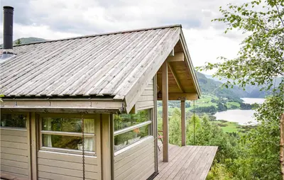 a tiny house with a view of a lake at Beautiful Home In Vossestrand With Wifi in Vossestrand