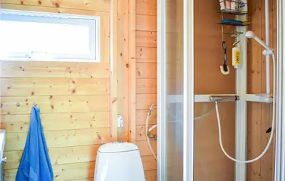 a bathroom with a toilet and a shower at Beautiful Home In Vossestrand With Wifi in Vossestrand