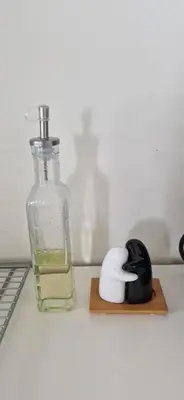 a bottle of water and a black and white object at Relaxing place on Godøya in Godøy
