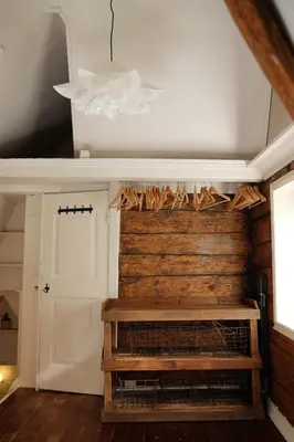 a living room with a fireplace and a white ceiling at Charming Bergen house, rare historic house from 1779, Whole house in Bergen