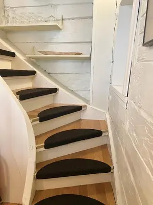 a set of stairs with black cushions at Charming Bergen house, rare historic house from 1779, Whole house in Bergen