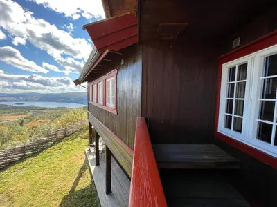 a porch of a cabin with a window and a view at Bjødnabakkens fjellutsikt in Beitostøl