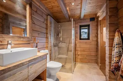 a bathroom with a toilet sink and a shower at Trysilsetra 35 in Trysil