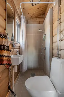 a bathroom with a shower toilet and a sink at Trysilsetra 35 in Trysil