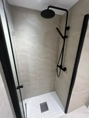 a shower stall with a glass door and a shower at Spacious 2-bedroom holiday apartment - Hemsedal Veslehorn 14 in Hemsedal