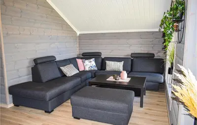 a living room with a couch and a table at Stunning Home In Rauland With Sauna in Rauland