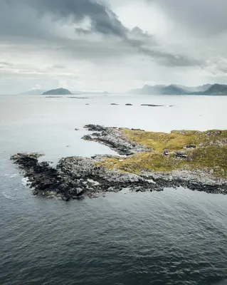 an island in the middle of a body of water at Runde Panorama - Trollvogga in Runde