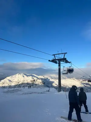 a group of people on a ski lift in the snow at Fyri Tunet Hemsedal in Hemsedal