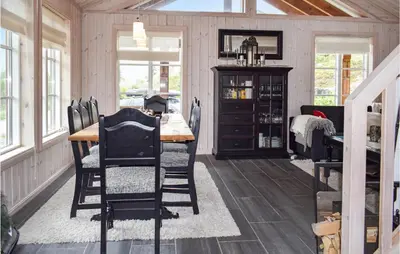 a dining room with a table and chairs at Cozy Home In Rjukan With Kitchen in Rjukan