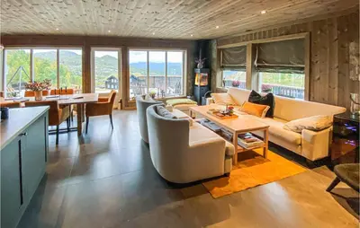 a living room with a couch and a table at Awesome Home In Rauland With Wifi in Rauland