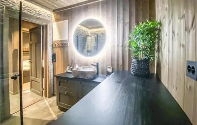 a bathroom with a sink and a mirror at Awesome Home In Rauland With Wifi in Rauland