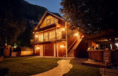 a house with a pathway leading to it at night at Lodgen Stryn in Stryn