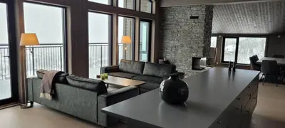 a living room with a couch and a table at Gausta Residence in Gaustablikk