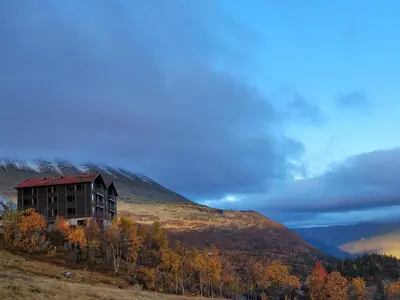 a building on the side of a hill at Gausta Residence in Gaustablikk