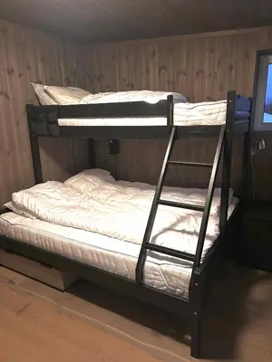 a couple of bunk beds in a room at Flott leilighet i Vestlia - ski in/ski out in Geilo