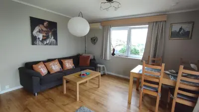 a living room with a couch and a table at Apartment , Øygarden, Bergen in Torsteinsvik