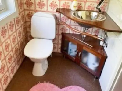a small bathroom with a toilet and a sink at 4 person holiday home in Svelgen-By Traum in Sørgulen