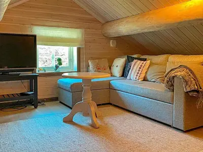 a living room with a couch and a table at 10 person holiday home in Rauland-By Traum in Rauland