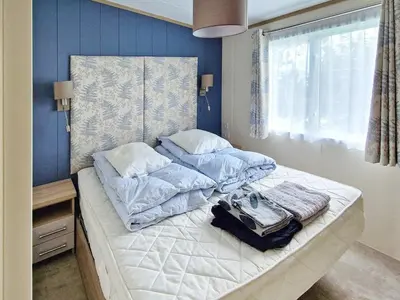 a bedroom with a bed with two pillows at 6 person holiday home in Tansøy-By Traum in Tansøy
