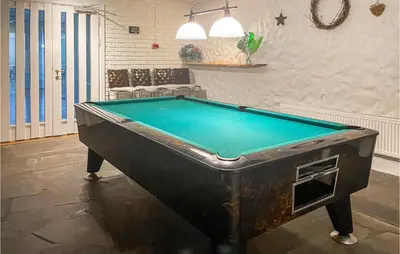 a pool table in a room with at Stunning Apartment In Lillehammer in Lillehammer