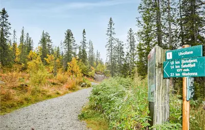 a street sign on a trail in a forest at 4 Bedroom Pet Friendly Home In Eggedal in Eggedal