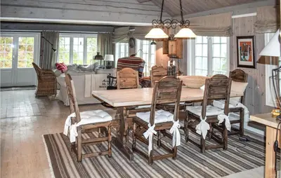 a dining room with a wooden table and chairs at 4 Bedroom Pet Friendly Home In Eggedal in Eggedal
