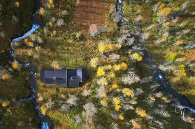 an overhead view of a black building in a forest at Voss Waterfalls - Norway Mountain Cabin & Traveller Award Winner! in Vossevangen