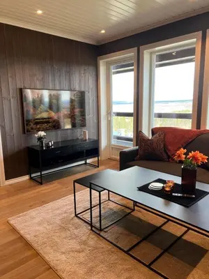 a living room with a couch and a coffee table at Bualie Golsfjellet in Gol