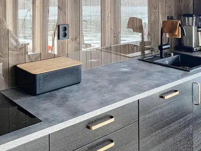 a kitchen with a counter with a sink and a counter sidx sidx sidx at 7 person holiday home in Huglo-By Traum in Nordhuglo