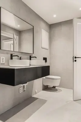a bathroom with a sink and a toilet and a mirror at Odda Panorama in Odda