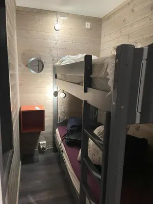 a small room with two bunk beds in it at Kozy apartment in Hemsedal, centrally located in Hemsedal