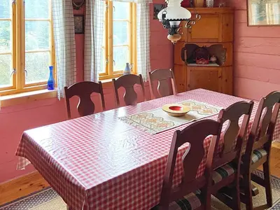 a dining room table with a red and white checkered table cloth at 4 person holiday home in HARDBAKKE-By Traum in Hardbakke